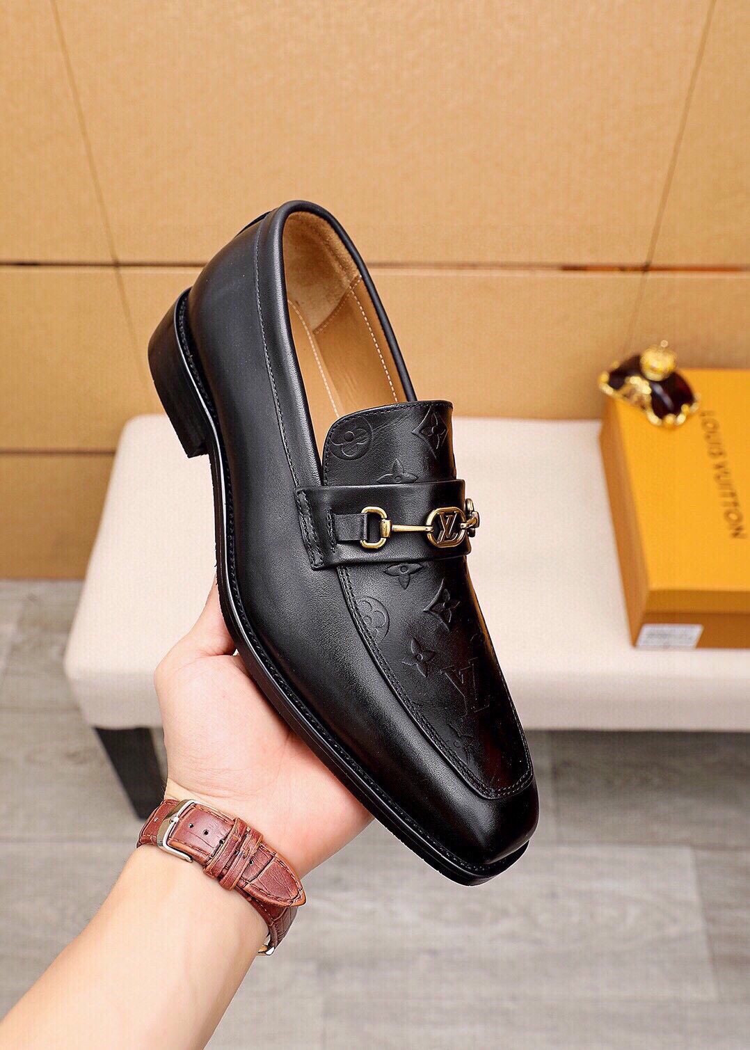 Louis Vuitton Embossed Buckle Loafers — model