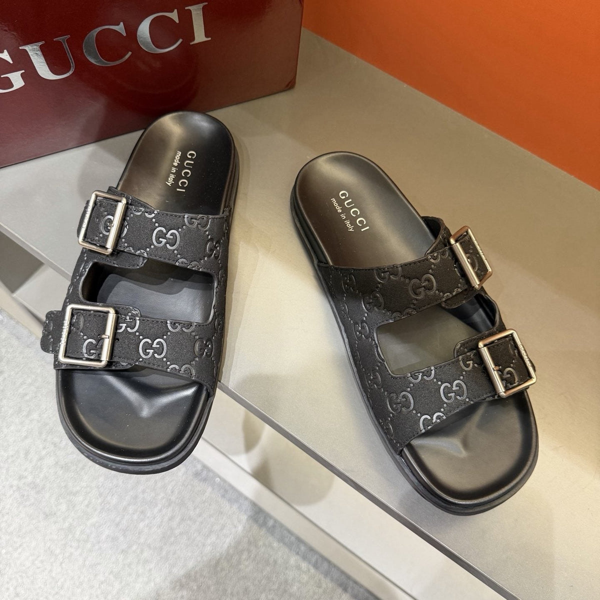 Gucci Two-Buckle Monogram Slide Sandals — model